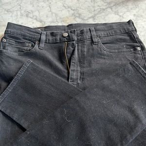 Levi’s Black distressed straight leg jeans.